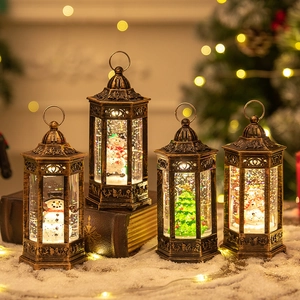 Vintage bronze Christmas lantern with glitter water globe, Santa and snowman interior