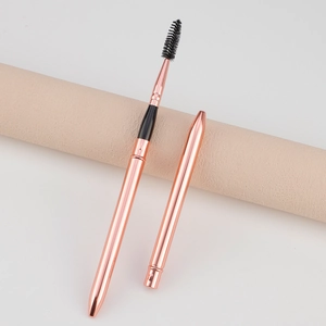 Portable rose gold spiral eyelash brush with protective cap for travel makeup needs