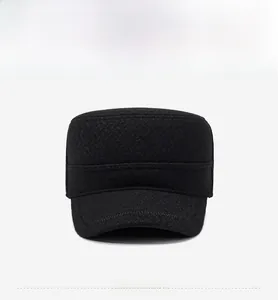 Front view of a classic black wool flat top cadet cap with a metal logo detail