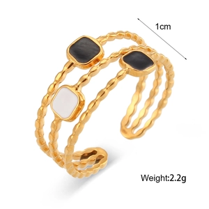Detail showing 1cm width and 2.2g weight of 18K gold plated celestial ring with enamel