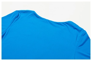 Close-up of the smooth neckline on a bright blue high-stretch athletic yoga t-shirt