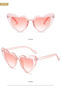 Front and side views of heart-shaped glitter pink sunglasses with gradient lenses