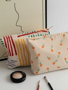 Floral and abstract corduroy makeup bags with metal zippers for storage
