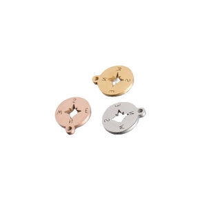 Three hollow compass pendants in gold rose gold and silver stainless steel