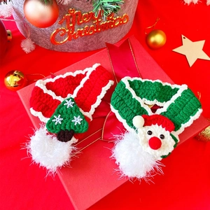 Handmade knitted Christmas scarves for pets with tree and Santa patterns in a gift box