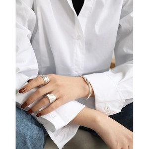 Minimalist S925 sterling silver set featuring irregular textured rings and a sleek cuff