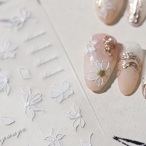 5D embossed white floral nail art stickers with textured flower and letter designs