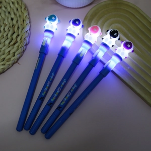 Astronaut glowing spinner pens in five colors shown with LED lights on in dark setting