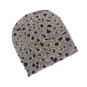 Detailed view of the leopard print jacquard knit beanie with soft warm fabric texture