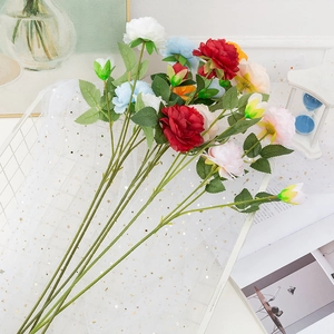 Silk Persian Buttercup bouquet in various colors within a white wire basket for wedding decor