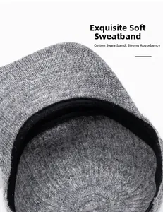 Detail of soft black cotton sweatband inside a grey knitted winter baseball cap
