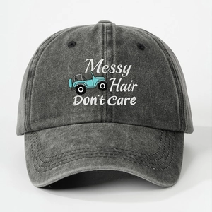 Detail of washed cotton baseball cap with blue off-road car and Messy Hair slogan