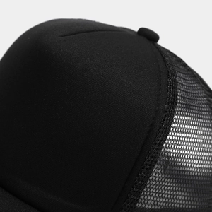 Close-up of the breathable polyester mesh and structured sponge crown on this black trucker hat