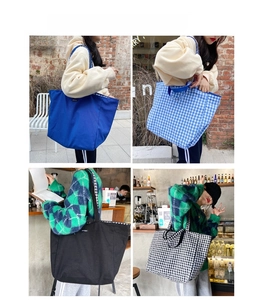 Detailed views of checkered and solid canvas tote bags showing strap durability and capacity