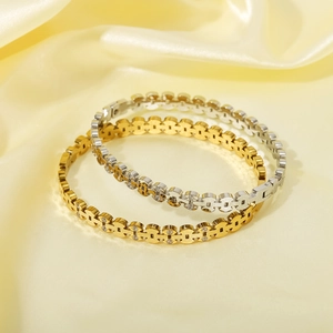 Polished stainless steel multilayer bangles with pavé rhinestones in gold and silver
