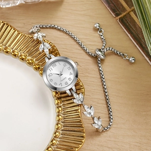 Detail of silver clover leaf bracelet watch with quartz movement and adjustable slide clasp