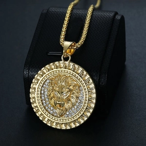 Gold plated lion head pendant necklace with sparkling rhinestones and box chain on stand