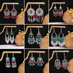 Set of nine Bohemian ethnic earrings featuring turquoise beads and retro silver tassels