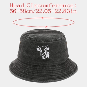 Detail of black washed denim bucket hat with cow embroidery and 56-58cm size specifications