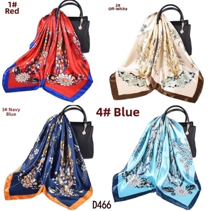 Floral print satin square scarves in red, cream, navy, and blue with contrast borders