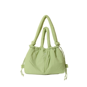 Stylish green padded nylon tote bag with drawstring details and soft quilted design