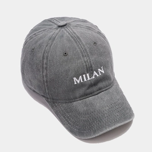 Detail view of Milan embroidery on washed gray cotton vintage baseball cap with curved brim