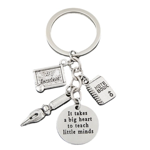 Silver teacher appreciation keychain with engraved notebook, pen and inspirational quotes