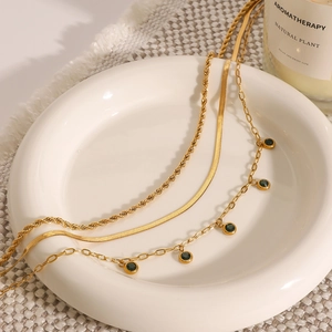 Three-layer gold stainless steel necklace set with green gems and flat snake chain