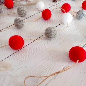 Christmas wool felt ball garland with red white and grey spheres on jute twine