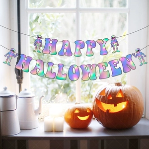 Rainbow gradient Happy Halloween banner with skull motifs hanging by a bright window