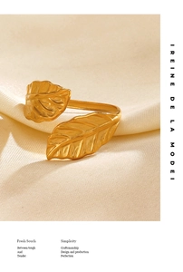Detail showing matte gold leaf texture and dual foliage design on the open ring