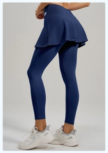 Detail view of high-waist fake two-piece yoga skort with elastic fabric in navy blue