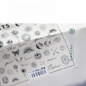 Close-up of 5D nail art stickers with mystic eye, moon and butterfly line patterns