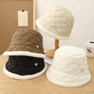 Quilted winter bucket hat with faux fur trim and metal M logo in four versatile colors