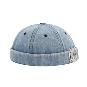 Vintage light blue washed denim docker cap with retro distressed edges for men and women