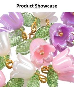 Macro detail of lily of the valley pendants in pink, purple and white with pearlescent finish