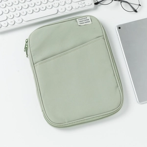 Detail of light green shockproof laptop sleeve with zipper and front pocket