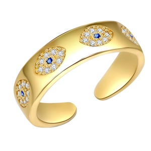 Adjustable gold evil eye ring with blue and white zircon stones in a 45-degree view