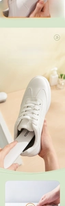 Detail of 170-degree tilted long handle shoe brush cleaning the inside of a white sneaker