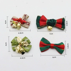 Detail view of assorted Christmas bows with bells and berries in various sizes