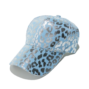 Detail of light blue twill baseball cap featuring metallic silver leopard print design