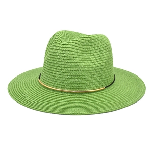 Detail view of woven grass sun hat in green with black band and gold metal hardware