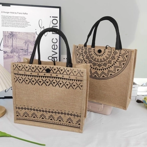 Detail showing natural jute tote bags with black bohemian prints and round woven handles
