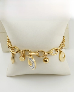 Close-up of gold stainless steel double-layered bracelet with crystal charms