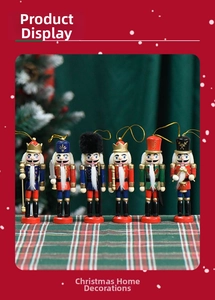 Close-up of 13cm wooden nutcracker ornaments with hand-painted details and gold hanging strings