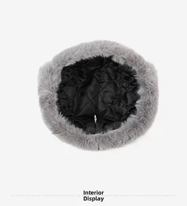 Detail view of the quilted black inner lining and grey faux fur of the winter trapper hat