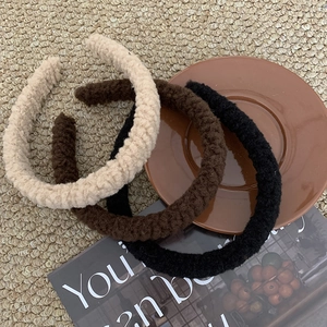 Plush lamb wool headbands in beige, brown and black colors for winter hair styling
