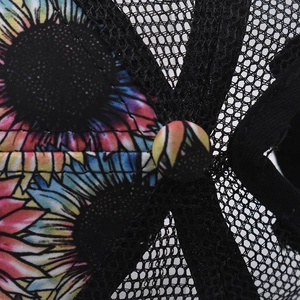 Close-up of sunflower print fabric and breathable mesh detailing on the ponytail baseball cap