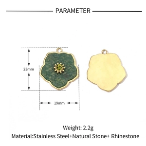Detail of flower shaped stainless steel pendant with green natural stone and 23mm size