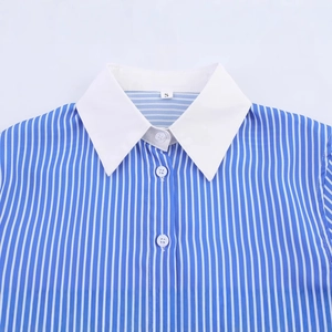 Front view of a loose blue and white vertical striped shirt with a white contrast collar